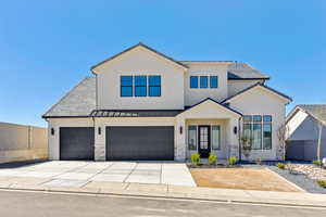 View of front of house featuring concrete driveway, stucco siding, a standing seam roof, and stone siding