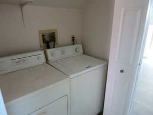 Laundry area with washer and clothes dryer
