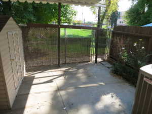 Gate featuring a patio