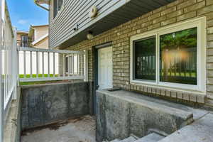 Entrance to property with stone siding