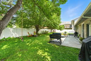 Fenced backyard with a patio and a mountain view