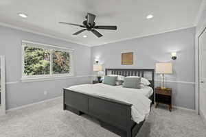 Bedroom with crown molding, light colored carpet, ceiling fan, recessed lighting, and a closet