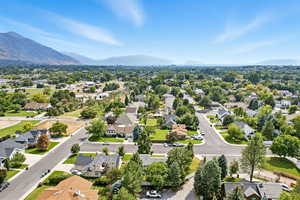 Aerial view of residential area featuring a mountain backdrop