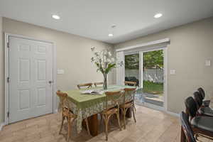 Dining room with recessed lighting and light tile patterned floors