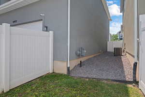 View of property exterior featuring stucco siding and a central air condition unit