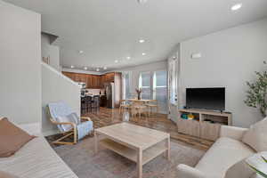 Living area featuring recessed lighting and dark wood finished floors