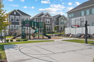 View of sport court with a residential view and community basketball court