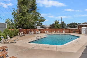 Community pool featuring a patio
