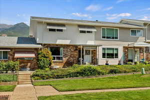 View of front of property with brick siding