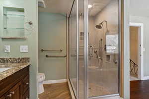 Full bath with vanity and a stall shower
