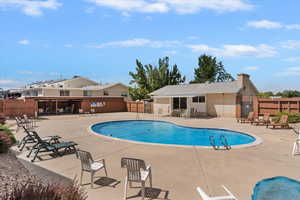 Community pool featuring a patio area