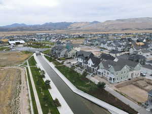 Aerial perspective of suburban area with a mountainous background