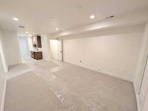 Basement featuring recessed lighting