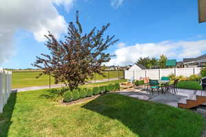 View of yard with a patio