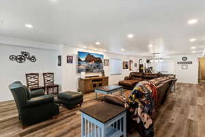 Living area featuring wood finished floors and recessed lighting