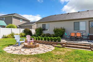 View of yard with a patio area and a fire pit