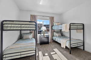 Bedroom with carpet flooring and baseboards