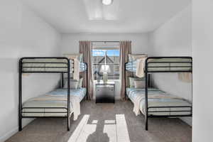 Carpeted bedroom with baseboards