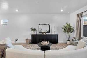 Living area featuring healthy amount of natural light and wood finished floors