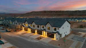 Aerial view at dusk of a residential view and a mountain view