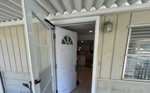 Doorway to property with board and batten siding