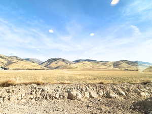 View of mountain background featuring rural landscape