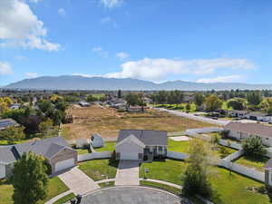 Aerial view of residential area featuring a mountainous background