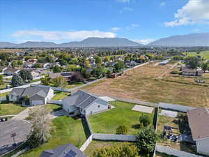 Aerial view of residential area featuring a mountain backdrop