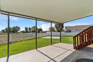 Fenced backyard with a patio area