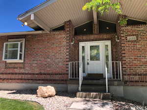 Property entrance with brick siding