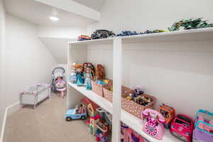 Interior space with carpet floors and a textured ceiling