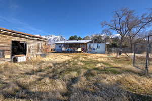 Back of property with a mountain view