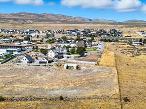 Aerial perspective of suburban area with a mountain backdrop
