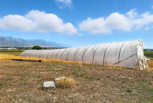 View of mountain background featuring rural landscape