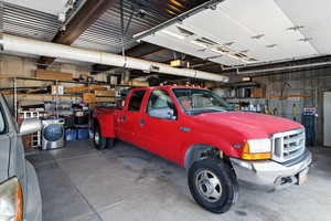 Garage with storage shelves and a garage door opener