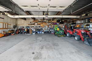 Garage with a garage door opener and a workshop area