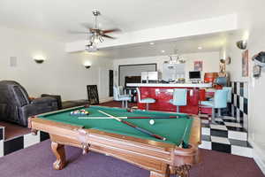 Game room featuring pool table, ceiling fan, recessed lighting, carpet floors, and beamed ceiling