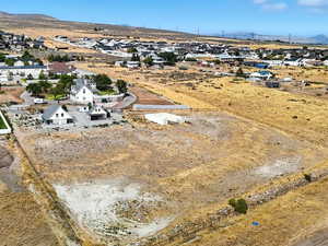 Aerial perspective of suburban area with a mountainous background