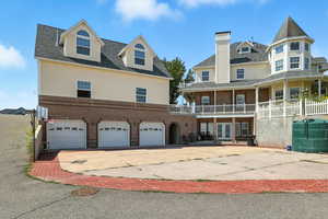 View of building exterior with driveway and an attached garage