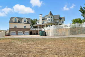 Back of house with a garage