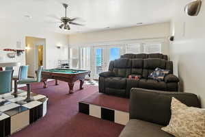 Recreation room featuring billiards table, carpet floors, a ceiling fan, and french doors