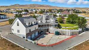 Aerial perspective of suburban area with a mountain backdrop