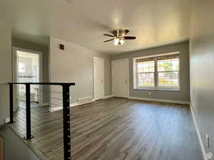 Foyer entrance featuring wood finished floors and ceiling fan