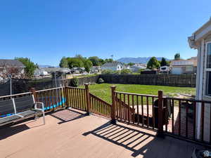 Deck featuring a residential view and a fenced backyard