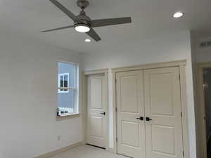 Unfurnished bedroom featuring light carpet, a closet, ceiling fan, and recessed lighting