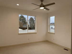 Empty room featuring carpet floors, recessed lighting, and ceiling fan