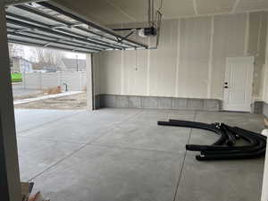 Garage featuring a garage door opener