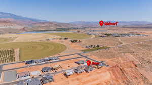 Aerial view of property and surrounding area with rural landscape and a mountain backdrop