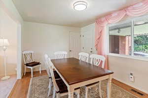 Dining room featuring light wood-style floors and baseboards