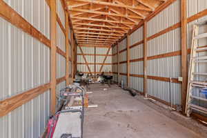 Garage featuring metal wall
